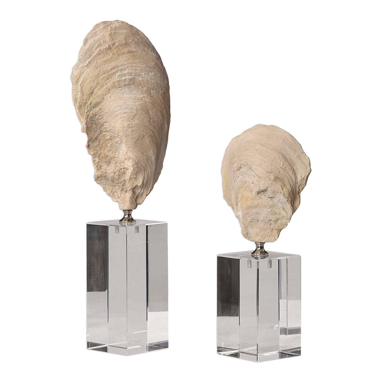 these beautiful sculptures feature an aged ivory finish with chrome accents and set atop staggered height crystal cube bases (set/2).