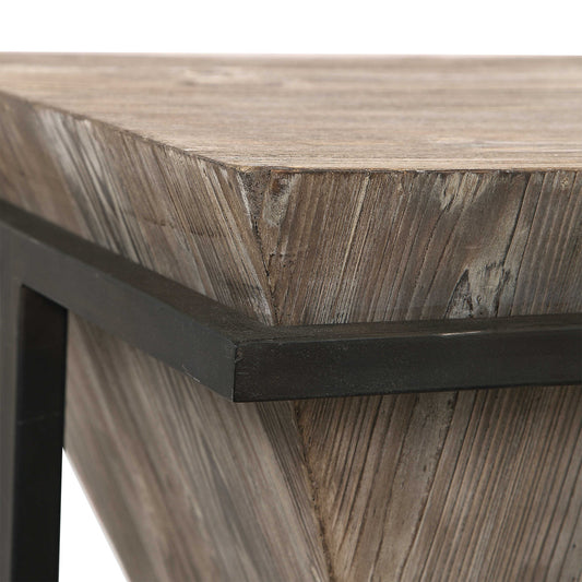 Close up view of an angled wood coffee table. 