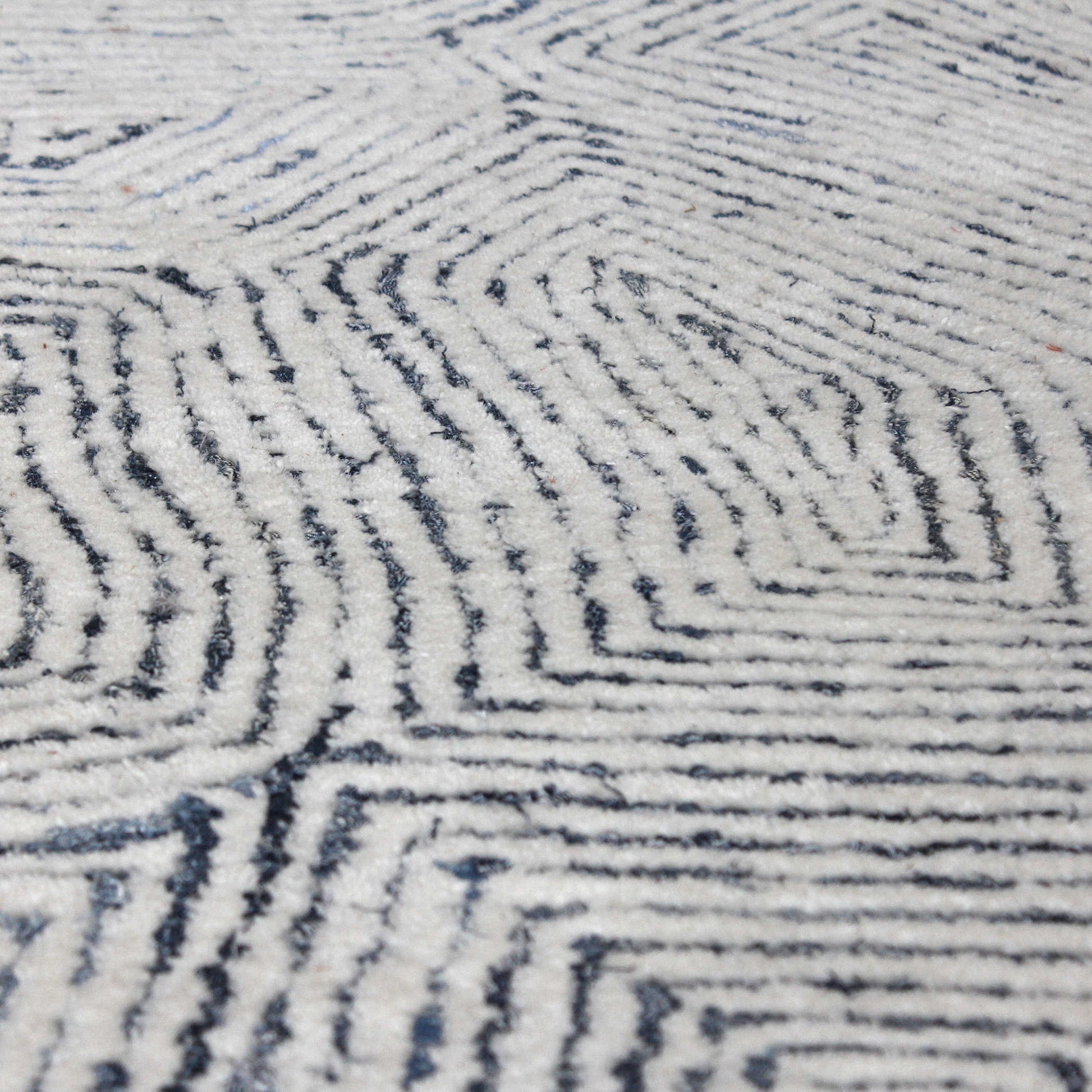 Close up shot of the fibers that make up this wool rug. 