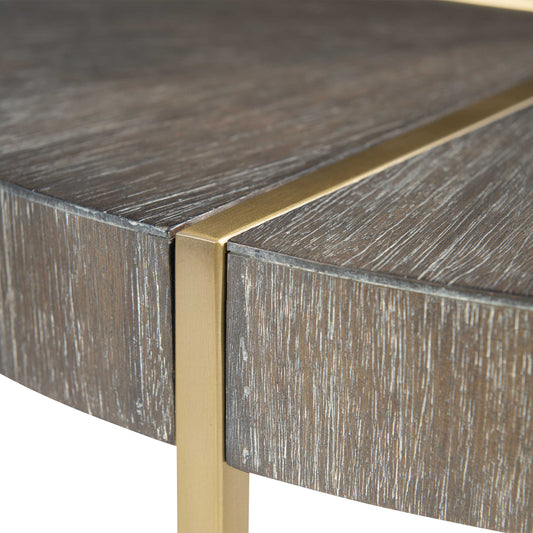 Close-up view of brass accent with wood table.